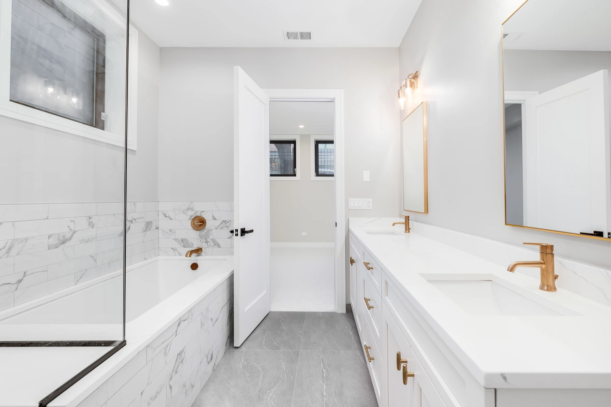 Luxurious white master bathroom renovation