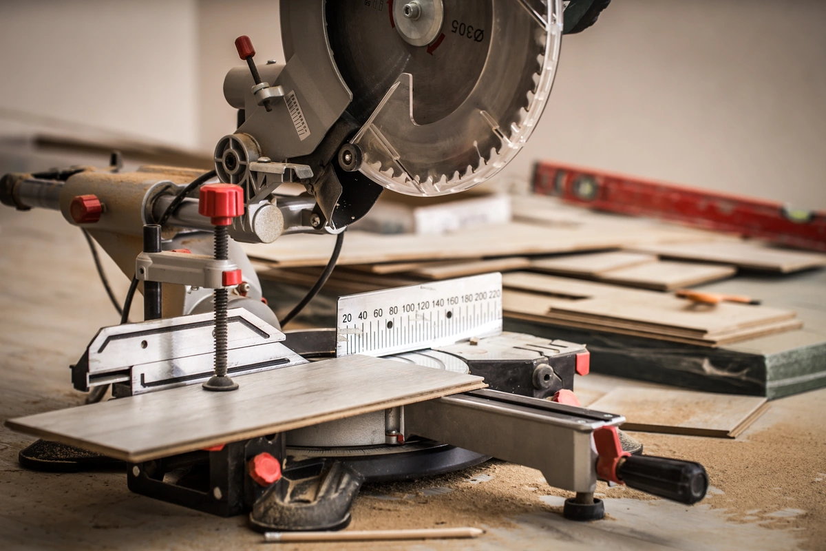 before installation of flooring cutting with miter saw