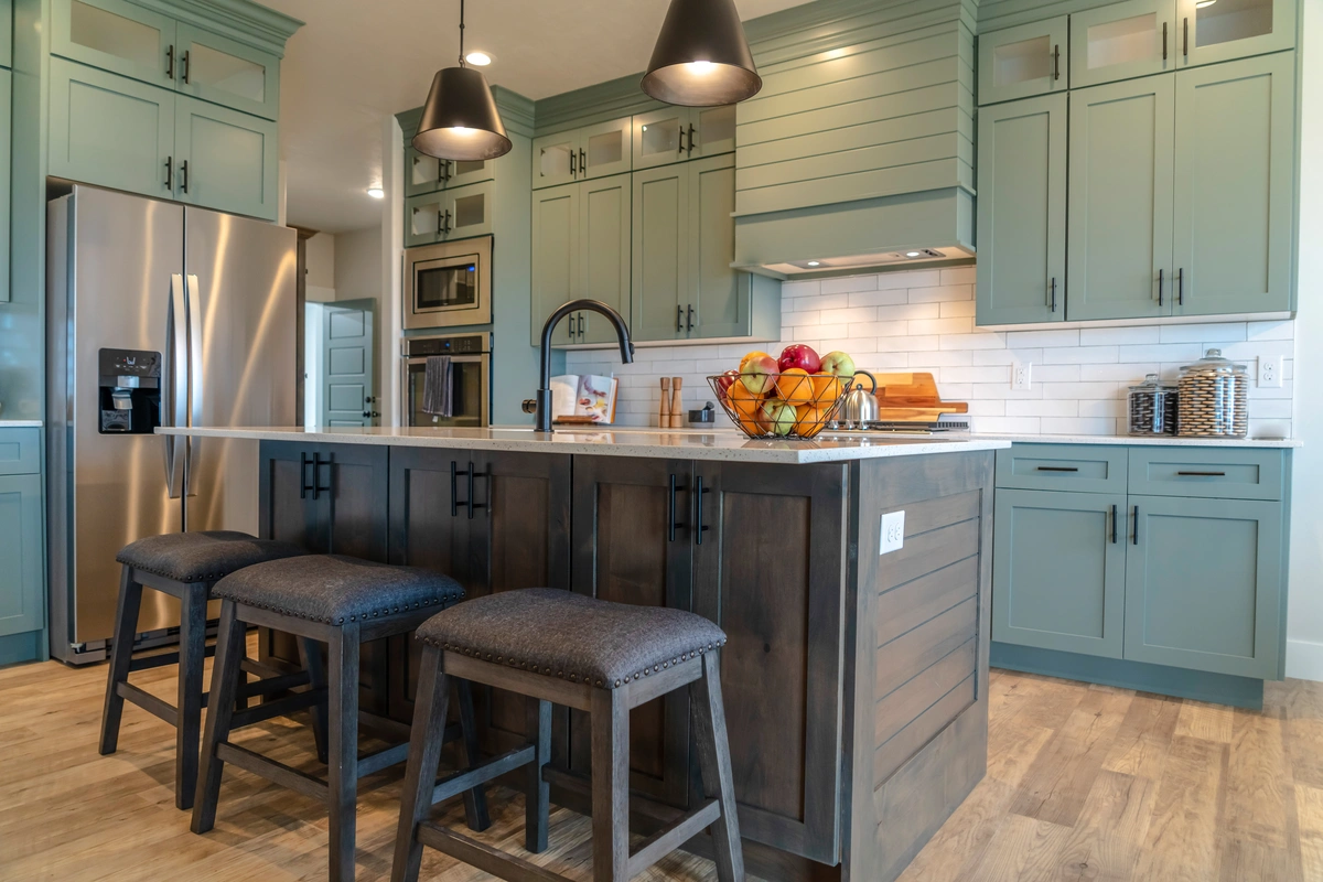 large kitchen with island cabinets and stools