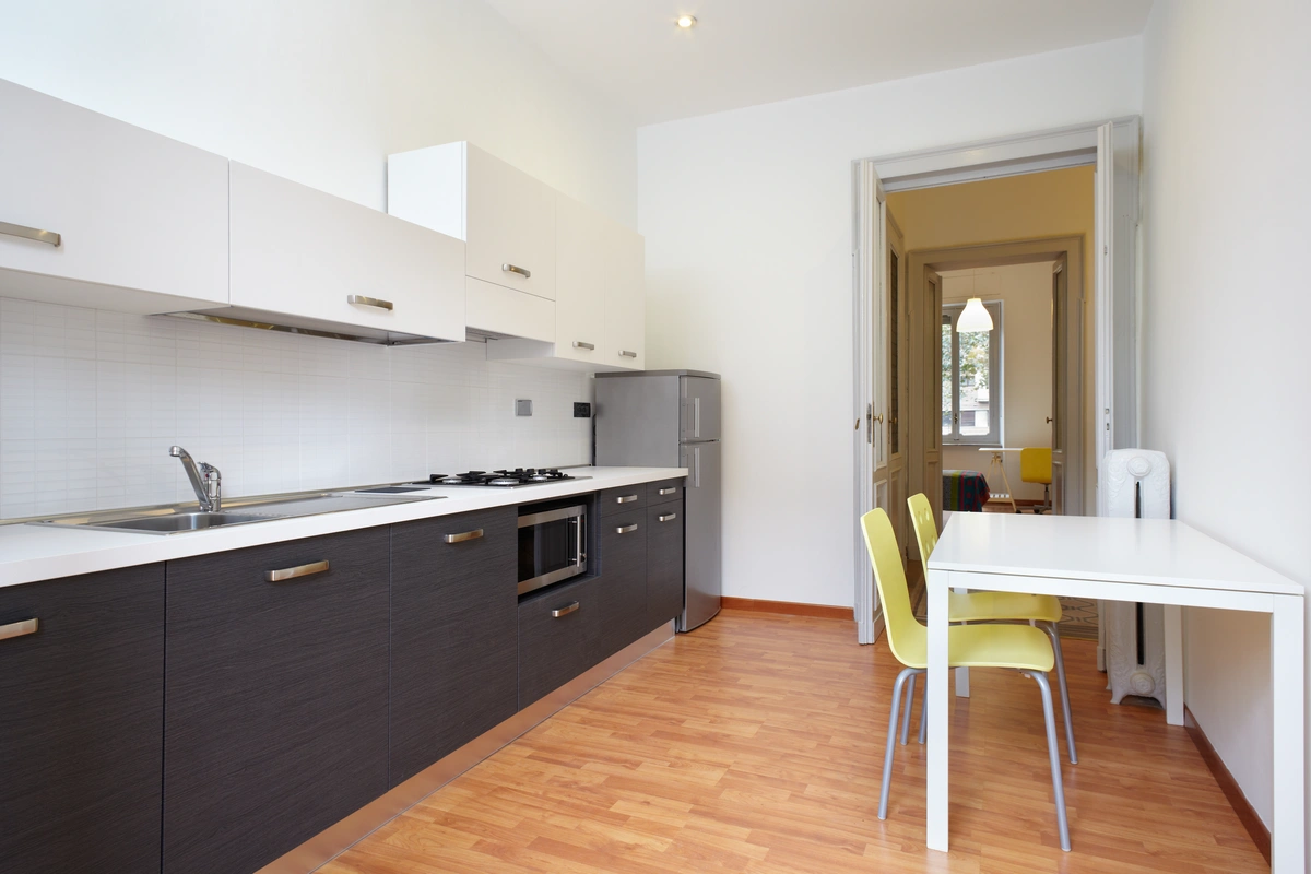small apartment kitchen with a table